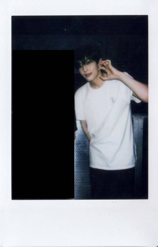 Hwon and a censored person polaroid