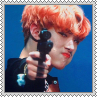 Mingi with red hair pointing a gun at the viewer square stamp